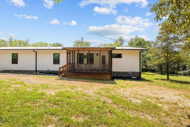 2006 Goodrich Rd, Nunnelly, TN 37137 - rear view of house featuring a yard