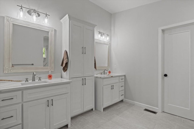 2006 Goodrich Rd, Nunnelly, TN 37137 - bathroom featuring two vanities and baseboards
