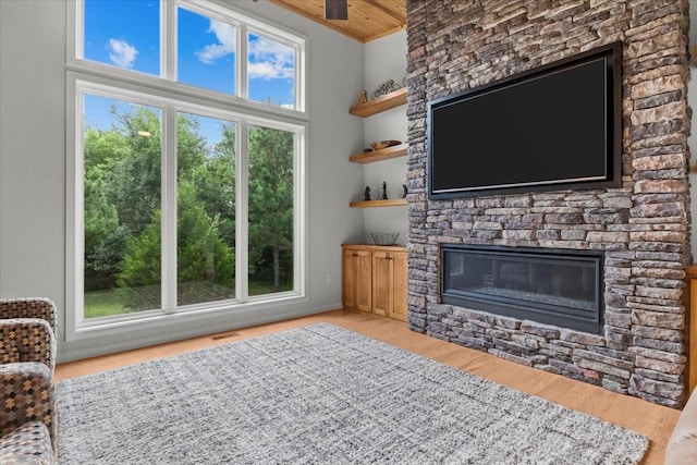 2006 Goodrich Rd, Nunnelly, TN 37137 - living area featuring a fireplace, wooden ceiling, and wood finished floors