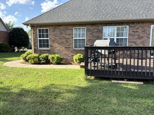 809 Renaissance Ave, Murfreesboro, TN 37129 - rear view of house featuring a shingled roof, brick siding, a wooden deck, and a lawn