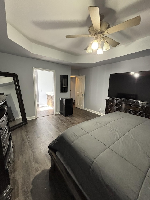 809 Renaissance Ave, Murfreesboro, TN 37129 - bedroom featuring dark wood-style flooring, ceiling fan, and a raised ceiling