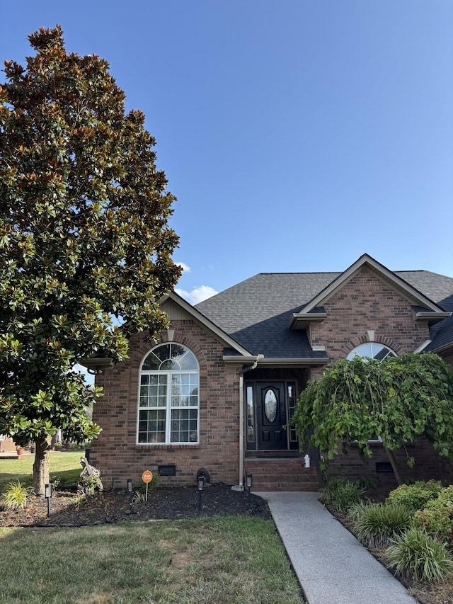 809 Renaissance Ave, Murfreesboro, TN 37129 - view of front of home with brick siding, a front lawn, a shingled roof, and entry steps