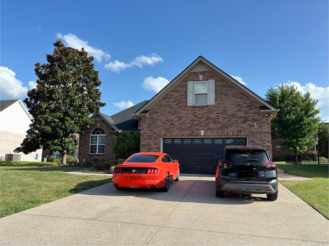 809 Renaissance Ave, Murfreesboro, TN 37129 - traditional-style house featuring brick siding, concrete driveway, an attached garage, and a front lawn