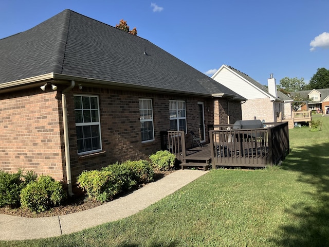 809 Renaissance Ave, Murfreesboro, TN 37129 - back of property with brick siding, a deck, roof with shingles, and a lawn