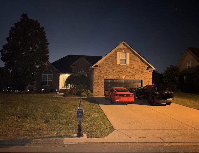 809 Renaissance Ave, Murfreesboro, TN 37129 - traditional home with concrete driveway, an attached garage, a lawn, and brick siding