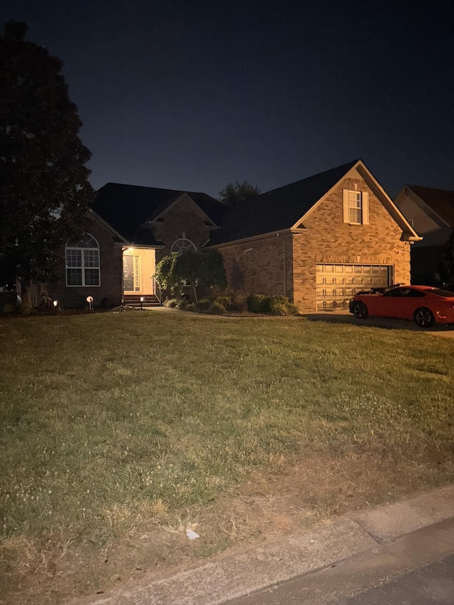 809 Renaissance Ave, Murfreesboro, TN 37129 - traditional-style house with a garage, a lawn, and brick siding