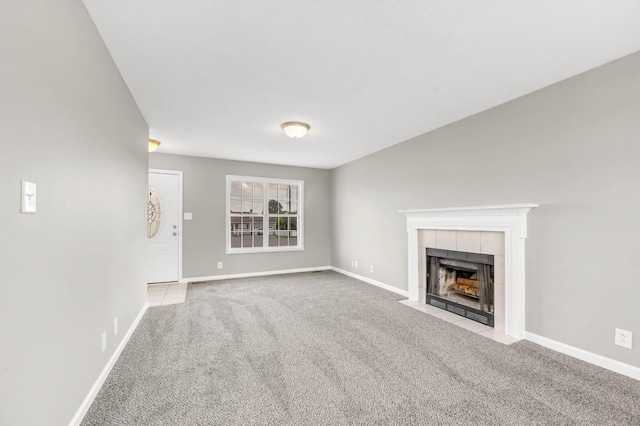 1373 Mackenzie Ct, Clarksville, TN 37042 - unfurnished living room featuring carpet and a tile fireplace