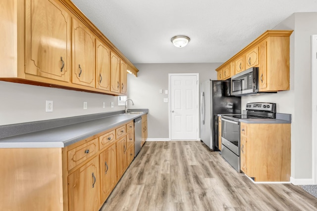 1373 Mackenzie Ct, Clarksville, TN 37042 - kitchen featuring appliances with stainless steel finishes and light wood-style floors