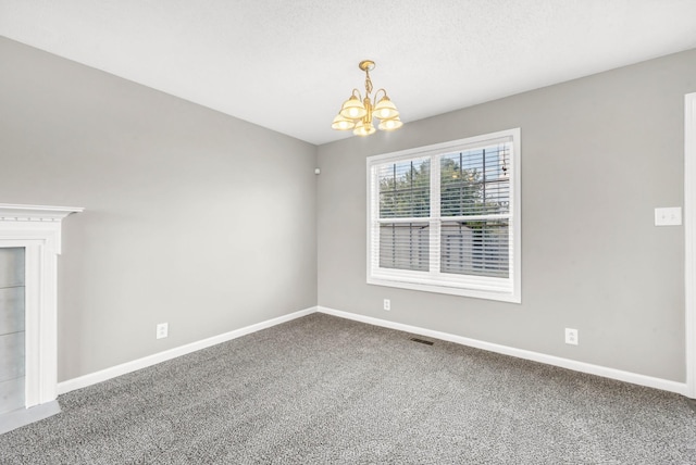 1373 Mackenzie Ct, Clarksville, TN 37042 - carpeted empty room featuring a chandelier and baseboards