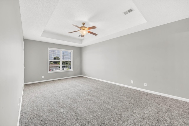 1373 Mackenzie Ct, Clarksville, TN 37042 - empty room with a tray ceiling, a ceiling fan, and carpet