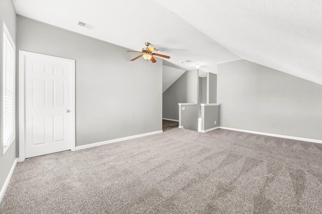 1373 Mackenzie Ct, Clarksville, TN 37042 - additional living space featuring carpet flooring, ceiling fan, lofted ceiling, and a textured ceiling