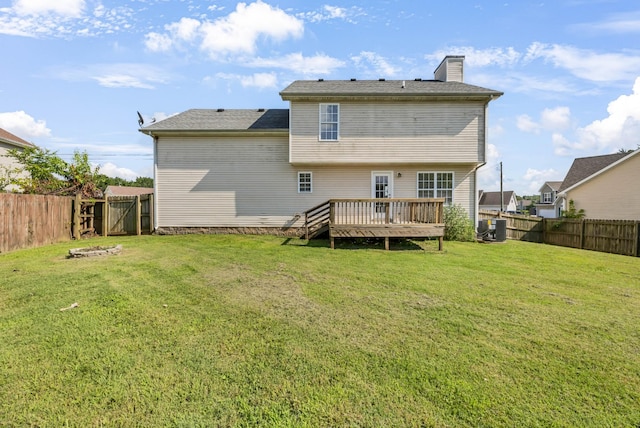 1373 Mackenzie Ct, Clarksville, TN 37042 - rear view of house featuring a deck, a fenced backyard, and a chimney