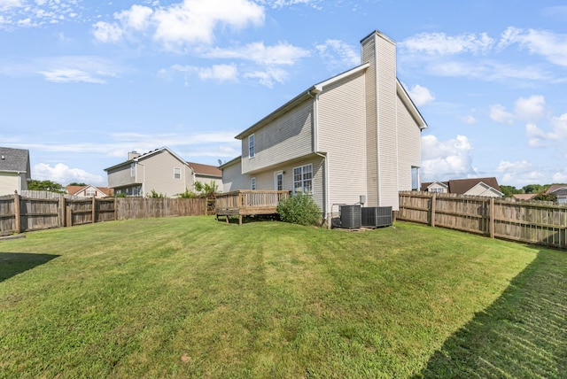 1373 Mackenzie Ct, Clarksville, TN 37042 - rear view of property with a fenced backyard, a chimney, and a deck