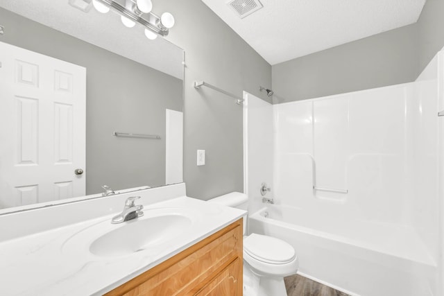 1373 Mackenzie Ct, Clarksville, TN 37042 - full bathroom with vanity, shower / bath combination, wood finished floors, and a textured ceiling