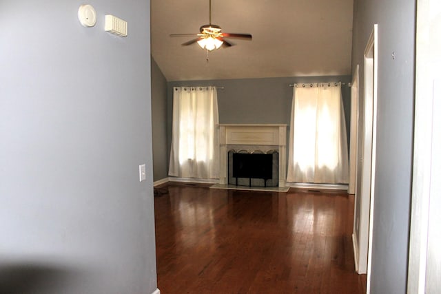 109 Hunter Dr, Mount Juliet, TN 37122 - unfurnished living room with vaulted ceiling, ceiling fan, dark wood finished floors, and a fireplace with raised hearth