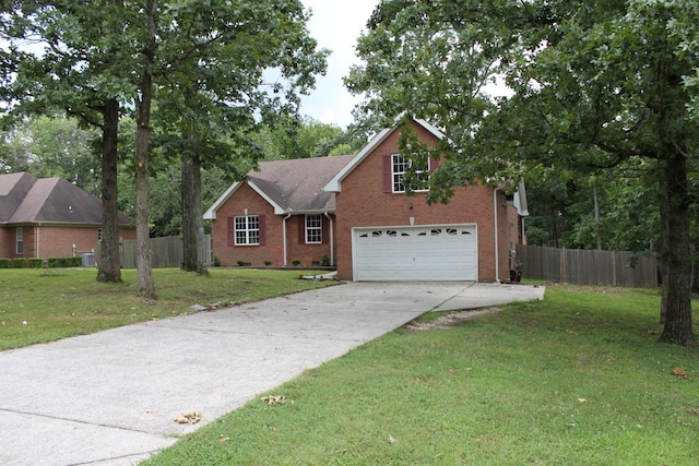 109 Hunter Dr, Mount Juliet, TN 37122 - view of front of property with a garage, brick siding, and driveway