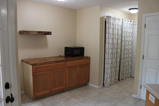109 Hunter Dr, Mount Juliet, TN 37122 - home office with light tile patterned floors and a textured ceiling