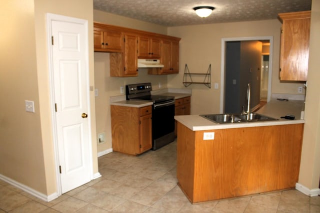 109 Hunter Dr, Mount Juliet, TN 37122 - kitchen with stainless steel range with electric stovetop, under cabinet range hood, brown cabinets, a peninsula, and light countertops