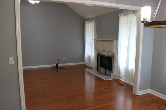 109 Hunter Dr, Mount Juliet, TN 37122 - unfurnished living room with a fireplace with flush hearth, vaulted ceiling, wood finished floors, and ceiling fan
