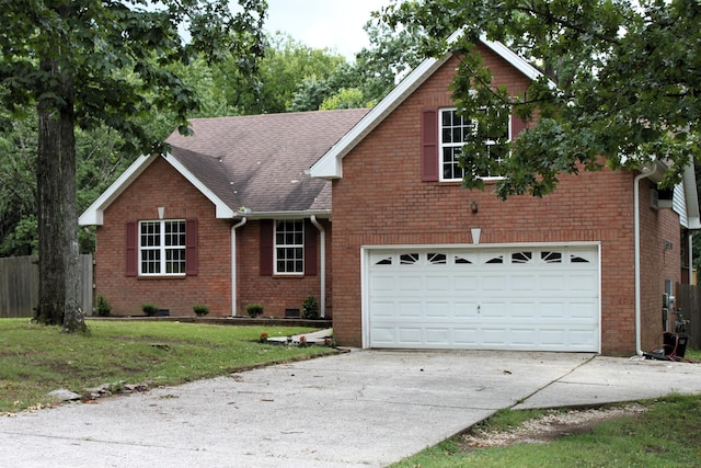 109 Hunter Dr, Mount Juliet, TN 37122 - view of front facade with driveway, brick siding, a garage, and roof with shingles