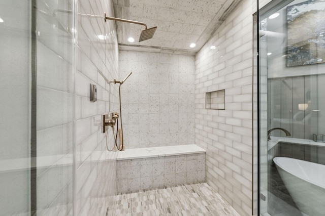 320 Liberty Pike Unit 205, Franklin, TN 37064 - bathroom with a stall shower, a freestanding tub, and recessed lighting
