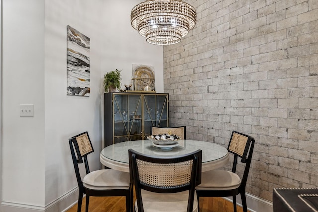320 Liberty Pike Unit 205, Franklin, TN 37064 - dining space featuring wood finished floors and a chandelier