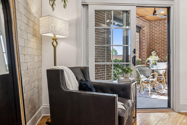320 Liberty Pike Unit 205, Franklin, TN 37064 - living area with wood finished floors and brick wall