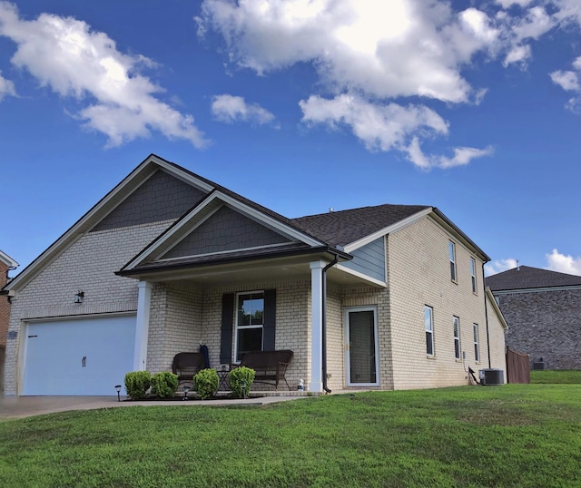 7118 Ivory Way, Fairview, TN 37062 - view of front of home with brick siding, a front lawn, an attached garage, a porch, and concrete driveway
