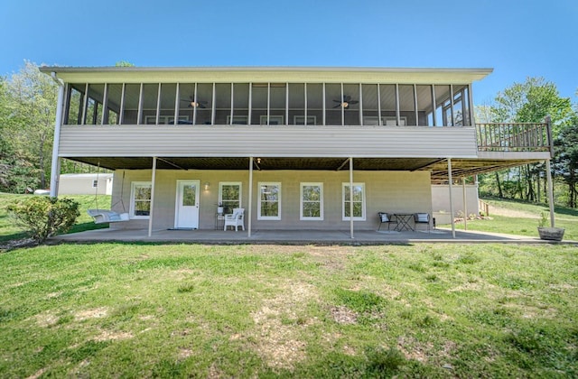 3205 Rocky Point Ln, Stewart, TN 37175 - back of property with a sunroom, a patio area, and a lawn