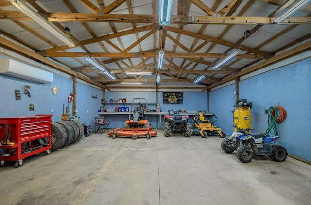 3205 Rocky Point Ln, Stewart, TN 37175 - garage featuring a wall mounted air conditioner and a workshop area