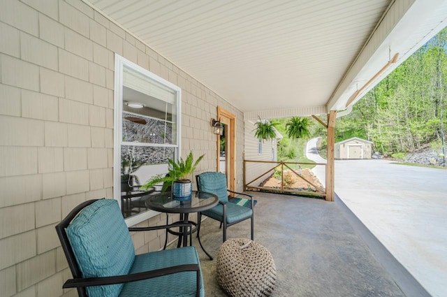 3205 Rocky Point Ln, Stewart, TN 37175 - covered porch with an outbuilding