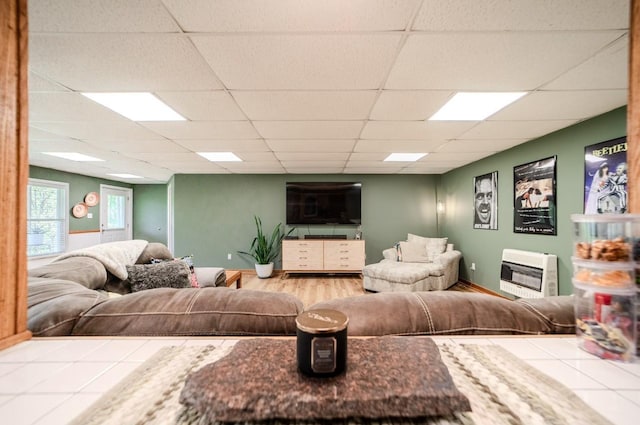 3205 Rocky Point Ln, Stewart, TN 37175 - tiled living room featuring heating unit and a paneled ceiling