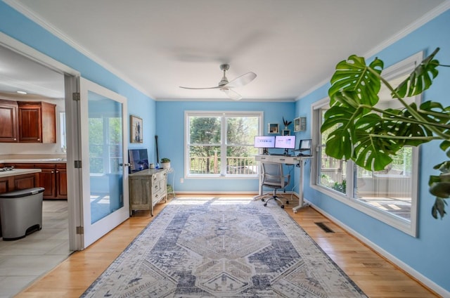 3205 Rocky Point Ln, Stewart, TN 37175 - living area featuring ornamental molding, ceiling fan, light wood-style floors, and french doors