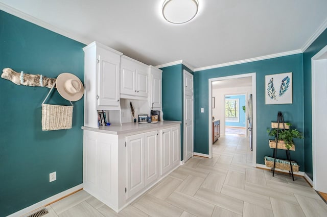 3205 Rocky Point Ln, Stewart, TN 37175 - kitchen with light countertops, white cabinets, and ornamental molding