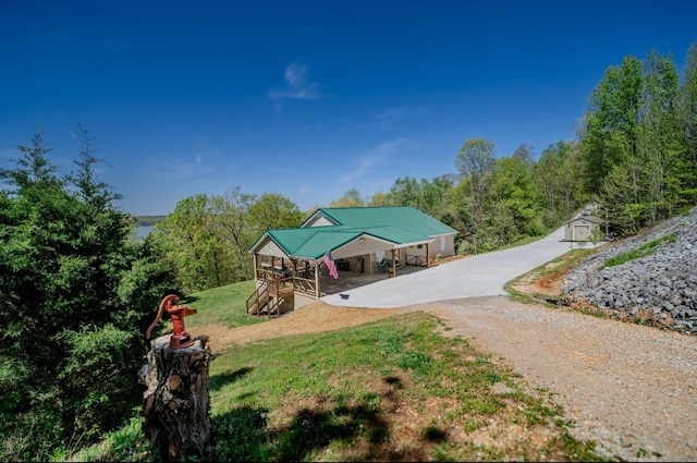 3205 Rocky Point Ln, Stewart, TN 37175 - country-style home with driveway, a front lawn, and a carport