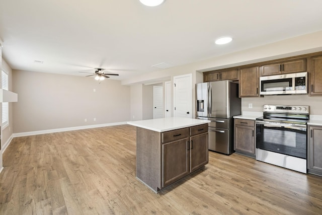 145 Irish Hls, Clarksville, TN 37042 - kitchen with appliances with stainless steel finishes, ceiling fan, light wood-style floors, and light countertops