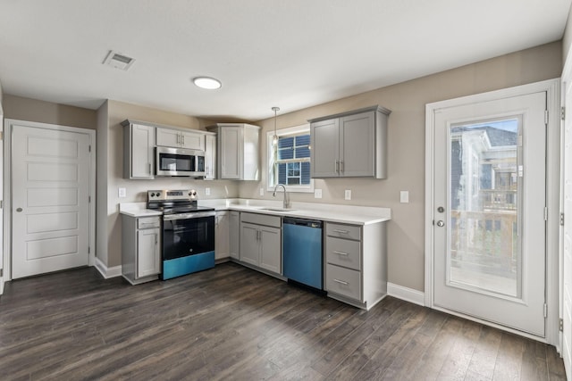 148 Irish Hls, Clarksville, TN 37042 - kitchen with appliances with stainless steel finishes, gray cabinets, light countertops, and dark wood-type flooring