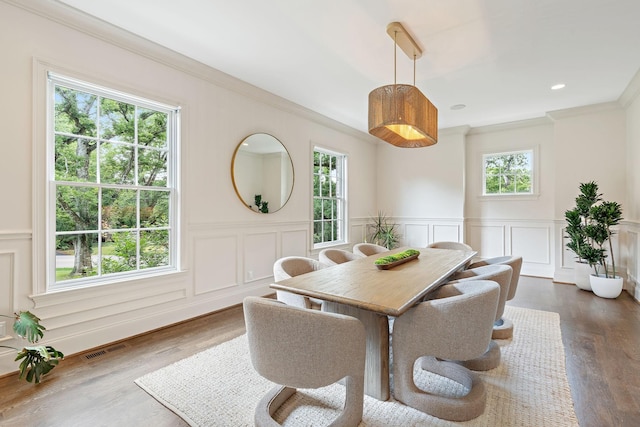 4220 Kirtland Rd, Nashville, TN 37215 - dining area with healthy amount of natural light, ornamental molding, a decorative wall, dark wood finished floors, and wainscoting