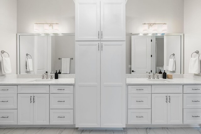 4220 Kirtland Rd, Nashville, TN 37215 - bathroom featuring marble look tile flooring and two vanities