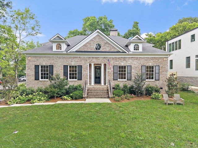 4220 Kirtland Rd, Nashville, TN 37215 - view of front of property with brick siding, a front yard, a chimney, and a shingled roof
