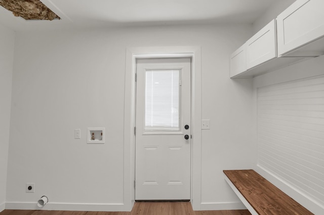 306 Forrest St, Watertown, TN 37184 - laundry area with cabinet space, hookup for a washing machine, electric dryer hookup, and light wood-style floors