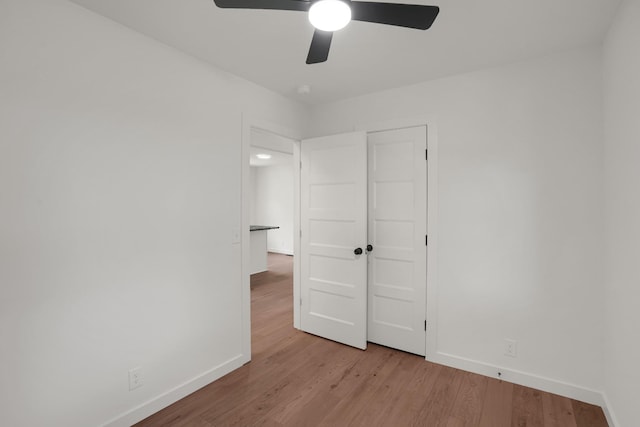 306 Forrest St, Watertown, TN 37184 - unfurnished bedroom with wood finished floors and ceiling fan