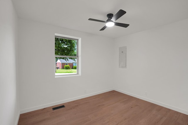 306 Forrest St, Watertown, TN 37184 - unfurnished room featuring electric panel, light wood finished floors, and ceiling fan