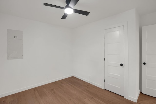 306 Forrest St, Watertown, TN 37184 - unfurnished room featuring electric panel, wood finished floors, and a ceiling fan