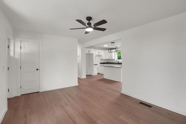 306 Forrest St, Watertown, TN 37184 - unfurnished living room featuring a ceiling fan and light wood finished floors