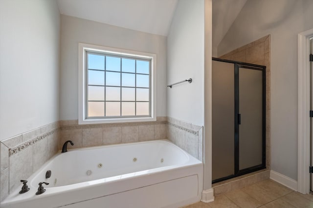 312 Retriever Ct, Clarksville, TN 37043 - full bath featuring a stall shower, a whirlpool tub, tile patterned flooring, and lofted ceiling
