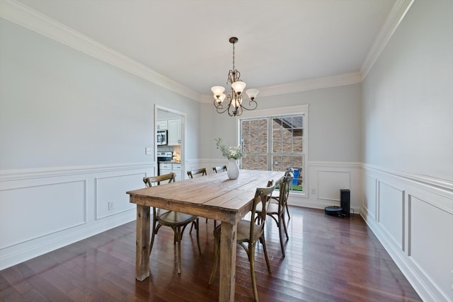 312 Retriever Ct, Clarksville, TN 37043 - dining space featuring a chandelier, ornamental molding, wainscoting, dark wood finished floors, and a decorative wall