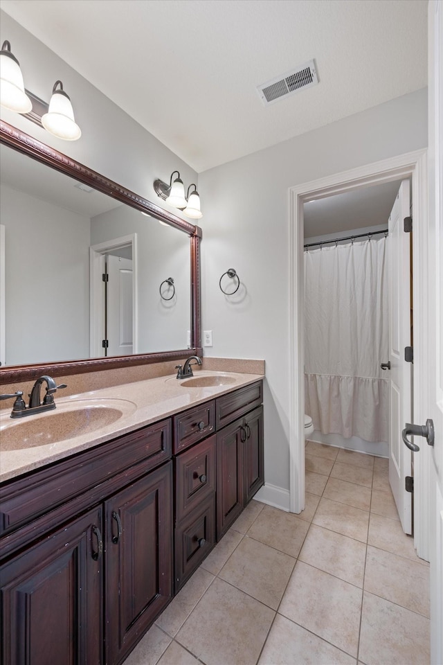 312 Retriever Ct, Clarksville, TN 37043 - full bath with double vanity, tile patterned flooring, and a shower with shower curtain