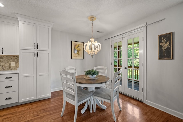 236 Slayden Cir, Clarksville, TN 37040 - dining room featuring a chandelier, light wood-style floors, a textured ceiling, and french doors