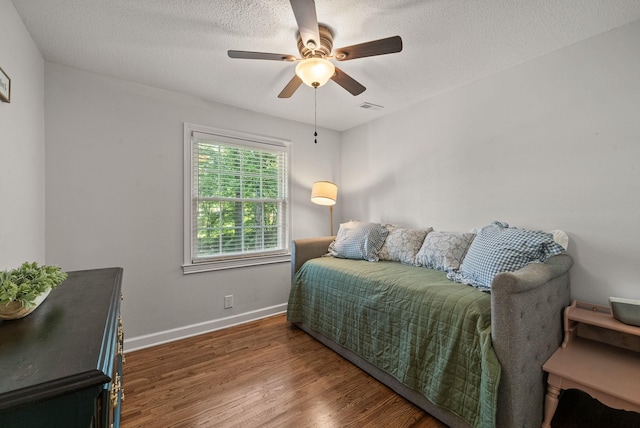 236 Slayden Cir, Clarksville, TN 37040 - bedroom featuring wood finished floors, ceiling fan, and a textured ceiling